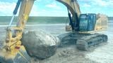 The O’Hare boulder, during extraction on June 16, 2026. For context, the excavator’s bucket is more than 6 feet wide. (Courtesy of Matt Tracy)