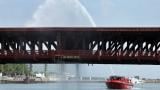 Water pumped by a Chicago Fire Department boat flows down onto the DuSable Lake Shore Drive bridge over the Chicago River on Wednesday. Sept. 2, 2026. The double-leaf, double-deck, fixed counterweight bridge became stuck earlier in the day. (Terrence Antonio James / Chicago Tribune via AP)