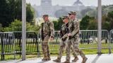 National Guard troops patrol the grounds of the Washington Monument with the Capitol seen in the distance as part of President Donald Trump's order to impose federal law enforcement in the nation's capital, in Washington, Thursday, Aug. 28, 2025. (AP Photo / J. Scott Applewhite)