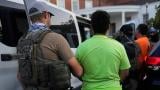 U.S. Immigration and Customs Enforcement agents make an arrest during an early morning operation in Park Ridge, Ill., Friday, Sept. 19, 2025. (AP Photo / Erin Hooley)
