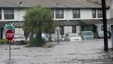 Vehicles sit in flood water at the Palm Isle apartments in the aftermath of Hurricane Ian, Thursday, Sept. 29, 2022, in Orlando, Fla. (AP Photo/John Raoux)