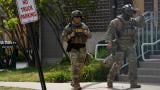 Enforcement and Removal Operations agents walk outside the U.S. Immigration and Customs Enforcement (ICE) building Wednesday, Sept. 24, 2025, in Broadview, Ill. (AP Photo/Erin Hooley)