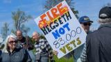 Approximately 200 people gathered outside the McHenry Veterans Affairs clinic April 27, 2025, in a protest organized by Illinois Veterans for Change. (Sonya Dymova / Medill Illinois News Bureau)