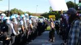 Protesters yell at a line of police officers at State and 35th streets, about 3 miles south of the Loop, where police set up a blockade on Sunday, May 31, 2020. (Evan Garcia / WTTW News)