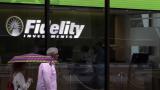 In this June 18, 2019, photo people walk past Fidelity Investments news scroll board, showing a favorable outlook in the US stock markets, in the Financial District of Boston. (AP Photo / Charles Krupa) In this June 18, 2019, photo people walk past Fidelity Investments news scroll board, showing a favorable outlook in the US stock markets, in the Financial District of Boston. (AP Photo / Charles Krupa)