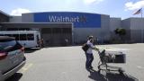 A customer pushes a shopping cart Tuesday, Sept. 3, 2019, outside a Walmart store, in Walpole, Massachusetts. (AP Photo / Steven Senne) A customer pushes a shopping cart Tuesday, Sept. 3, 2019, outside a Walmart store, in Walpole, Massachusetts. (AP Photo / Steven Senne)
