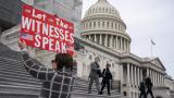 Laura Albinson of Pasadena, Md., displays a message for members of the House as they leave the Capitol in Washington, Friday, Jan. 10, 2020. (AP Photo / J. Scott Applewhite) Laura Albinson of Pasadena, Md., displays a message for members of the House as they leave the Capitol in Washington, Friday, Jan. 10, 2020. (AP Photo / J. Scott Applewhite)