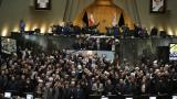 Iranian lawmakers chant slogans as some of them hold posters of Gen. Qassem Soleimani, who was killed in Iraq in a U.S. drone attack, in an open session of parliament, in Tehran, Iran, Tuesday, Jan. 7, 2020. (AP Photo / Vahid Salemi) Iranian lawmakers chant slogans as some of them hold posters of Gen. Qassem Soleimani, who was killed in Iraq in a U.S. drone attack, in an open session of parliament, in Tehran, Iran, Tuesday, Jan. 7, 2020. (AP Photo / Vahid Salemi)