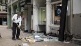 A man sweeps up outside Paul Young Fine Jewelers after looting broke out in the Loop and surrounding neighborhoods overnight, Monday morning, Aug. 10, 2020 in Chicago. (Ashlee Rezin Garcia / Chicago Sun-Times via AP) A man sweeps up outside Paul Young Fine Jewelers after looting broke out in the Loop and surrounding neighborhoods overnight, Monday morning, Aug. 10, 2020 in Chicago. (Ashlee Rezin Garcia / Chicago Sun-Times via AP)