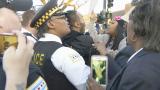 Tensions rose between protesters and police during a protest at the 11th District police station on April 9, 2024, following the release of video of the fatal police shooting of Dexter Reed. (WTTW News)