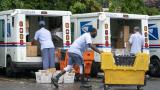 In this July 31, 2020, file photo, letter carriers load mail trucks for deliveries at a U.S. Postal Service facility in McLean, Va. The success of the 2020 presidential election could come down to a most unlikely government agency: the U.S. Postal Service. (AP Photo/J. Scott Applewhite, File) In this July 31, 2020, file photo, letter carriers load mail trucks for deliveries at a U.S. Postal Service facility in McLean, Va. The success of the 2020 presidential election could come down to a most unlikely government agency: the U.S. Postal Service. (AP Photo/J. Scott Applewhite, File)
