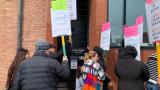 A group of former Foxtrot and Dom’s Kitchen and Market employees, and supporters, rallied in front of the Foxtrot Commissary in Pilsen on April 26, 2024, to demand back pay following abrupt closures of all Foxtrot and Dom’s stores. (Eunice Alpasan / WTTW News)