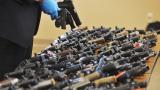 Dozens of recovered stolen handguns are displayed during a press conference, Nov. 21, 2023, in Benton Township, Mich. (Don Campbell / The Herald-Palladium via AP, File)