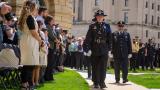 Uniformed officers honor the families of their fallen colleagues during the annual Police Officers Memorial on the Illinois State Capitol grounds Thursday, May 2, 2024, in Springfield. (Jerry Nowicki / Capitol News Illinois)