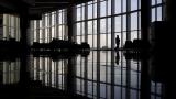 In this June 1, 2020 file photo, a woman looks through a window at a near-empty terminal at an airport in Atlanta. The coronavirus pandemic has taken a harsh toll on the mental health of young Americans, according to a new poll. (AP Photo/Charlie Riedel, File) In this June 1, 2020 file photo, a woman looks through a window at a near-empty terminal at an airport in Atlanta. The coronavirus pandemic has taken a harsh toll on the mental health of young Americans, according to a new poll. (AP Photo/Charlie Riedel, File)