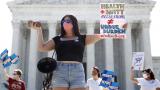 Terrisa Bukovinac, founder of Pro-Life San Francisco, holds a model of a fetus as she and other anti-abortion protesters wait outside the Supreme Court for a decision, Monday, June 29, 2020. (AP Photo / Patrick Semansky) Terrisa Bukovinac, founder of Pro-Life San Francisco, holds a model of a fetus as she and other anti-abortion protesters wait outside the Supreme Court for a decision, Monday, June 29, 2020. (AP Photo / Patrick Semansky)