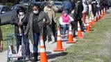 In this Tuesday, May 12, 2020, photo, residents from all walks of life line up for a food giveaway sponsored by the Greater Chicago Food Depository in the Auburn Gresham neighborhood of Chicago. (AP Photo / Charles Rex Arbogast) In this Tuesday, May 12, 2020, photo, residents from all walks of life line up for a food giveaway sponsored by the Greater Chicago Food Depository in the Auburn Gresham neighborhood of Chicago. (AP Photo / Charles Rex Arbogast)