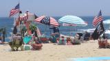 Flags line the beach in Belmar, N.J., on June 28, 2020. With large crowds expected at the Jersey Shore for the July Fourth weekend, some are worried that a failure to heed mask-wearing and social distancing protocols could accelerate the spread of the coronavirus. (AP Photo / Wayne Parry) Flags line the beach in Belmar, N.J., on June 28, 2020. With large crowds expected at the Jersey Shore for the July Fourth weekend, some are worried that a failure to heed mask-wearing and social distancing protocols could accelerate the spread of the coronavirus. (AP Photo / Wayne Parry)