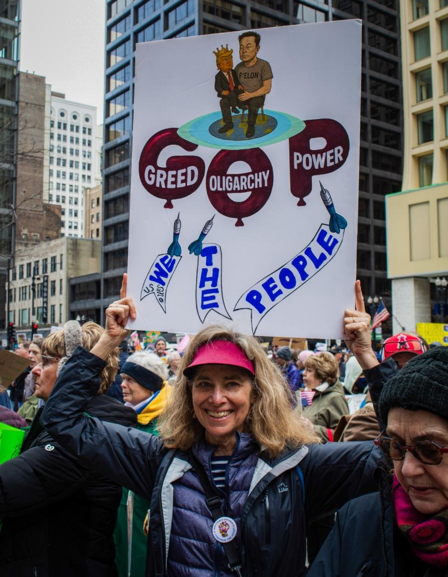 Janet Farr of Chicago said she spent hours crafting her own poster for the Hands-Off rally on Saturday, April 5, 2025. (Sonya Dymova / Medill Illinois News Bureau)
