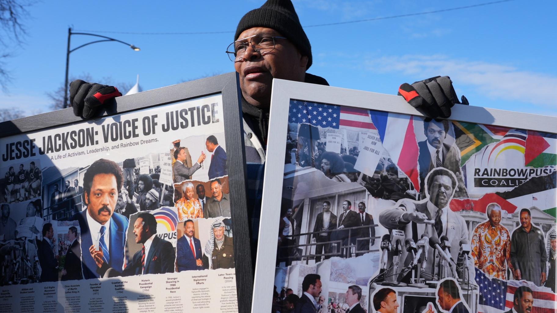 James Hickman holds a photo montage of the late Reverend Jesse Jackson before a public visitation at Rainbow/PUSH Coalition in Chicago, Thursday, Feb. 26, 2026. (AP Photo / Nam Y. Huh)