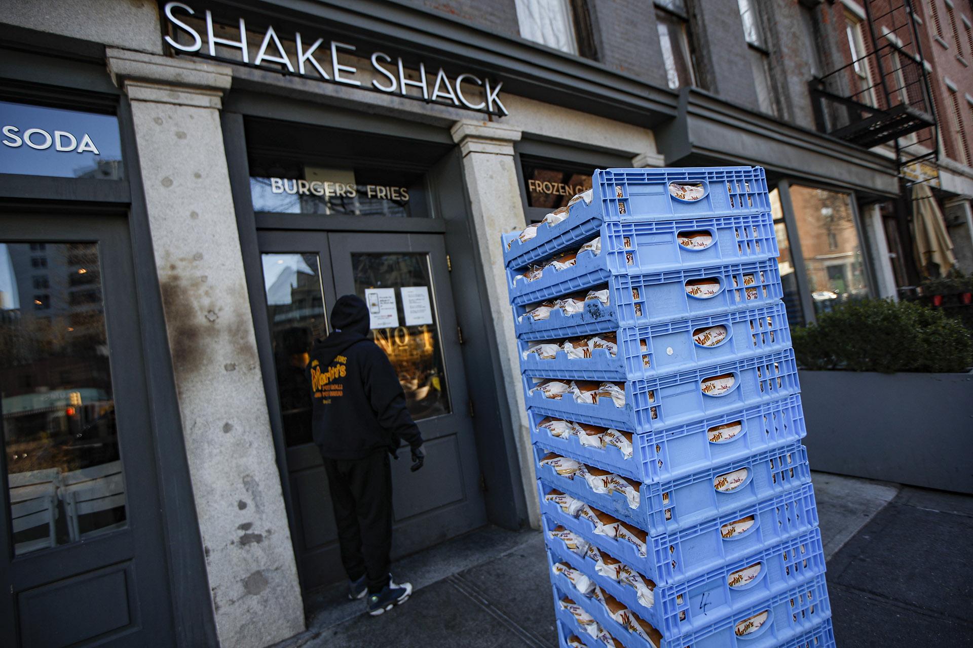 In this March 16, 2020, file photo, a bread delivery is made to a Shake Shack restaurant in the Brooklyn borough of New York. (AP Photo / John Minchillo, File)