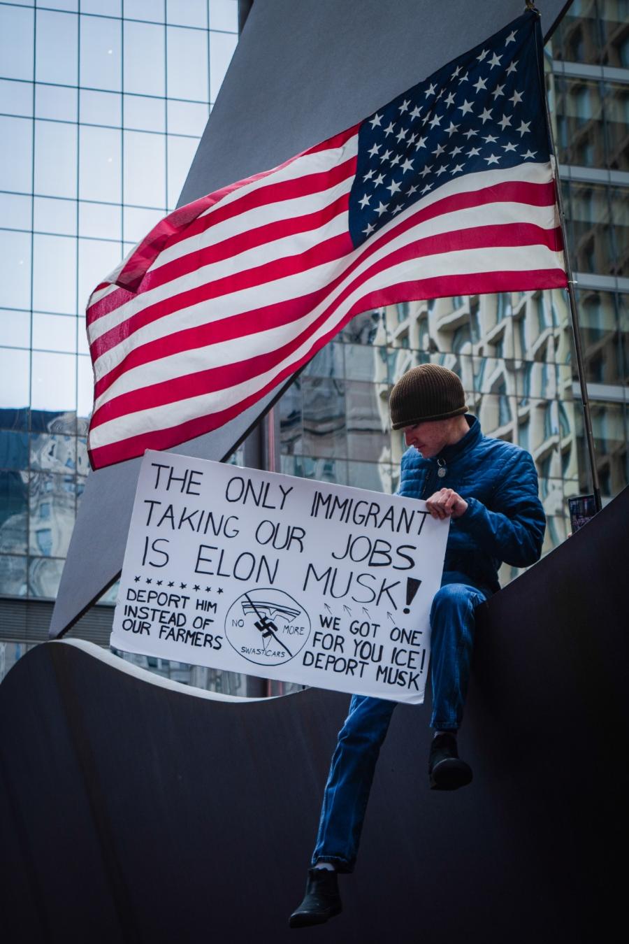 Homemade signs were common during the downtown Chicago protest on Saturday, April 5, 2025. (Sonya Dymova / Medill Illinois News Bureau)