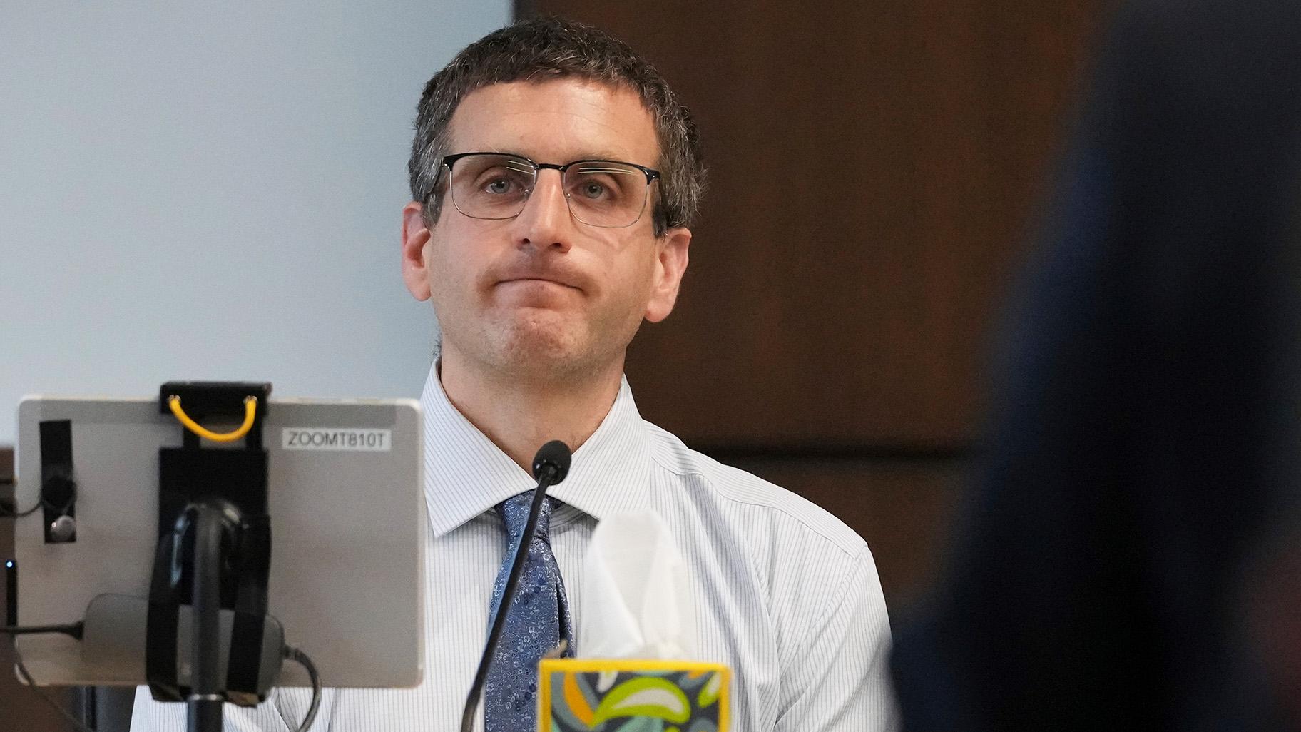Dr. Jeremy Smiley reacts as he answers a question from Lake County Assistant State's Attorney Ben Dillon during the sentencing hearing for Robert E. Crimo III., at the Lake County Courthouse, in Waukegan, Ill., Wednesday, April 23, 2025. (Nam Y. Huh / AP Photo, Pool)