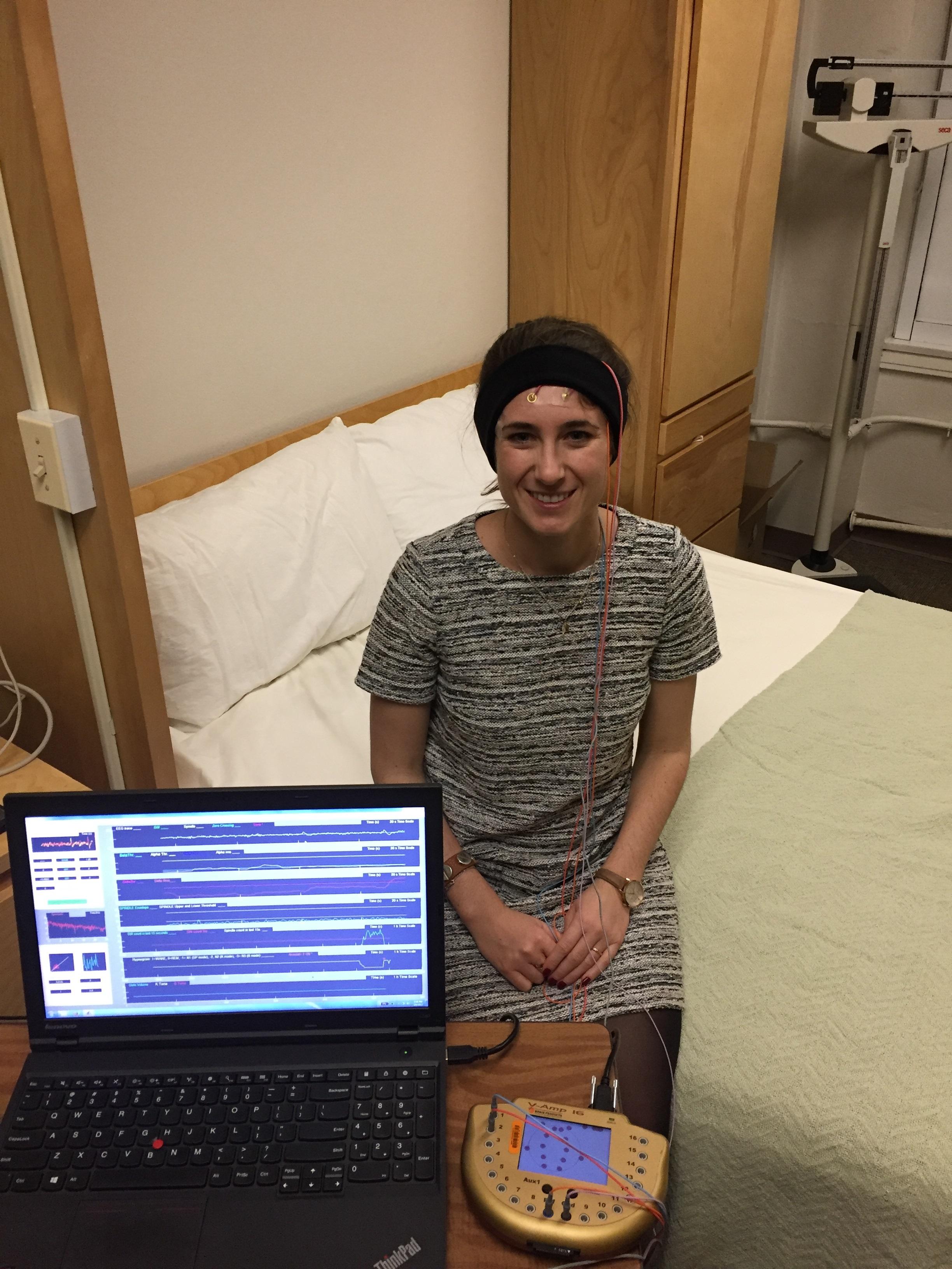 Nelly Papalambros, who is the first author of the study and neuroscience student at Northwestern, is pictured wearing a commercially available headband with wireless earphones used to deliver sound to sleeping participants. (Northwestern University)