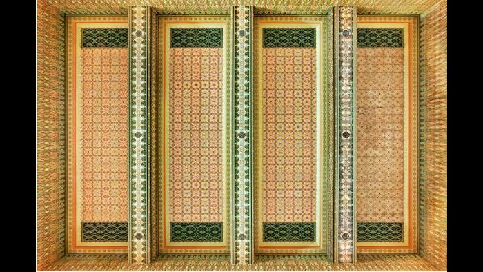 The left three bays of the Trading Room’s spectacular ceiling are re-creations while the darker far right panel was pieced together from original fragments.