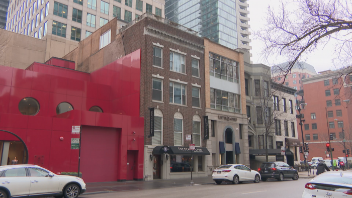 The brick building at 9 E. Huron St. may originally have been Italianate, but was updated in the Colonial Revival style in the early 20th Century. (Felix Mendez / WTTW News)