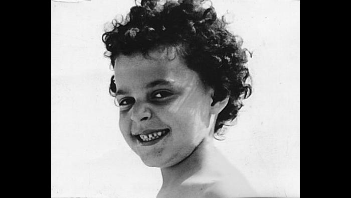 Curls and smiles—Diane as a child. (Courtesy of Diane von Furstenberg)
