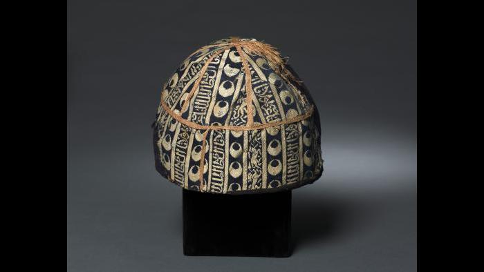 Cap with striped inscribed silk, Egypt or Syria, Mamluk period, probably sultanate of al-Nasir al-Din Muhammad (reigned 1293–1341, with two interruptions), 14th century, Lampas fabric, silk and gold, Cleveland Museum of Art, purchase from the J.H. Wade Fund, 1985.5