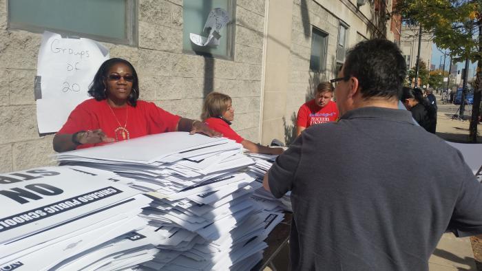 CTU workers distribute strike materials Monday at union headquarters.