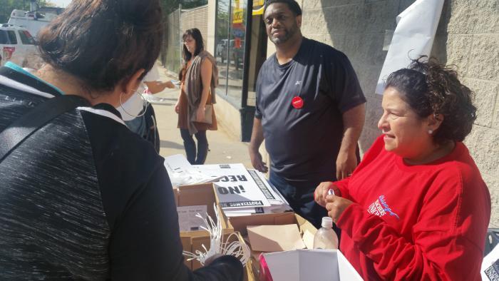 CTU workers distribute strike materials Monday at union headquarters.