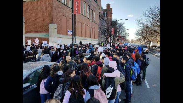 Students march outside Lake View High School. (Matt Masterson / Chicago Tonight)