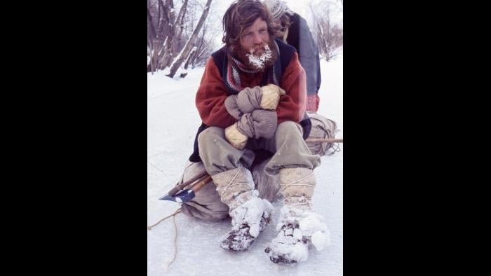 Terry Cox takes a break and tries to get warm on the Kankakee River near Shelby, Indiana, on January 11, 1977. (Photographers of the La Salle: Expedition II)