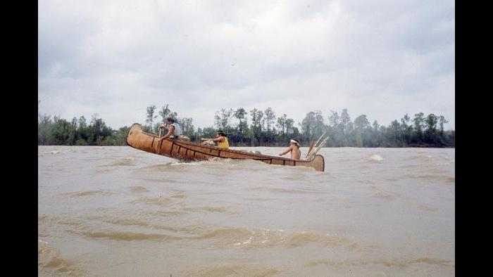 George LeSieutre, Sam Hess, and Mark Fredenburg fly through waves on the Mississippi River near Vicksburg, Mississippi on March 22, 1977. (Photographers of the La Salle: Expedition II)