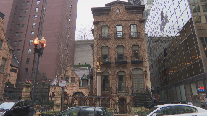 The brick Italianate building at 17 E. Erie St. is owned by businessman and philanthropist Richard Driehaus. (Felix Mendez / WTTW News)