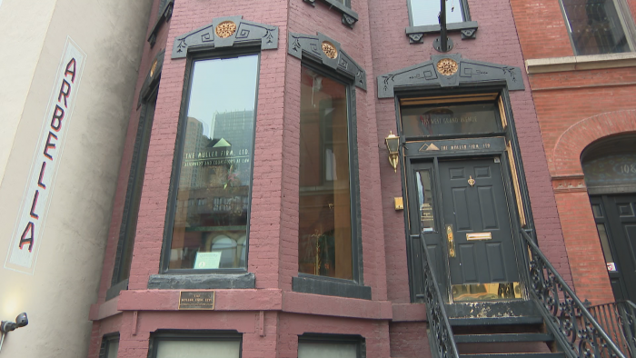 A brick building in the Italianate style at 110 W. Grand Ave. (Felix Mendez / WTTW News)