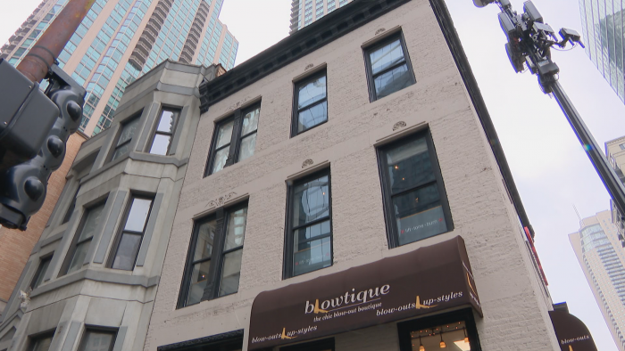 The three-story brick building at 1 E. Huron St. has Italianate-style ornamental features. (Felix Mendez / WTTW News)