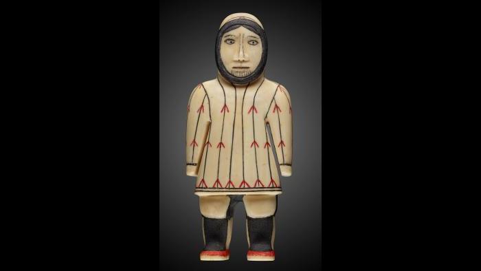 Yupik female figure with chin tattoo. (Courtesy of The Field Museum)