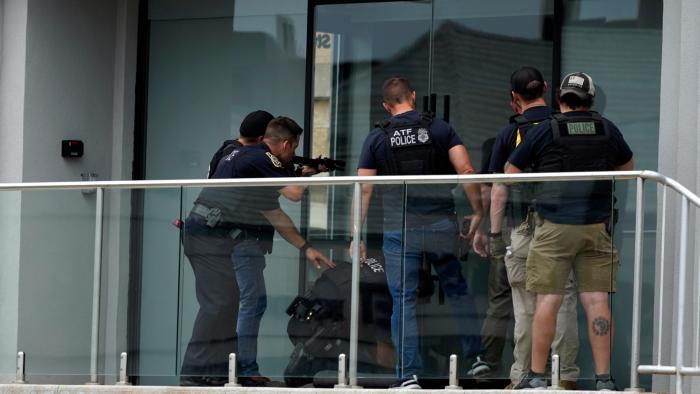 Law enforcement search in a building after a mass shooting at the Highland Park Fourth of July parade in downtown Highland Park, a Chicago suburb on Monday, July 4, 2022. (AP Photo / Nam Y. Huh)
