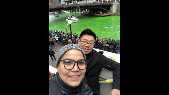 Andres Weig and Luciana Diaz photographed at the greening of the Chicago River.
