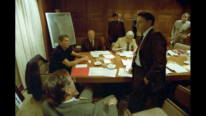Evening meeting in the Sit Room to discuss Lebanon Marine barracks bombing with George Bush, George Shultz, Caspar Weinberger, and senior staff of National Security Planning Group, October 23, 1983 Bud McFarlane and George Shultz brief Ronald Reagan on the situation in Grenada, Eisenhower Cabin, Augusta Golf Course, October 22, 1983.
