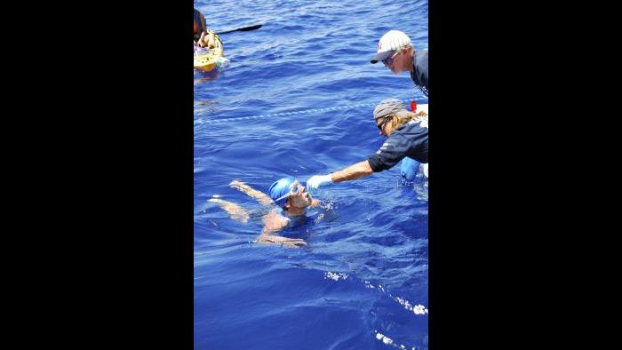 Nyad’s handler Bonnie Stoll feeding her during the swim. Nobody was allowed to touch Nyad while she was in the water.