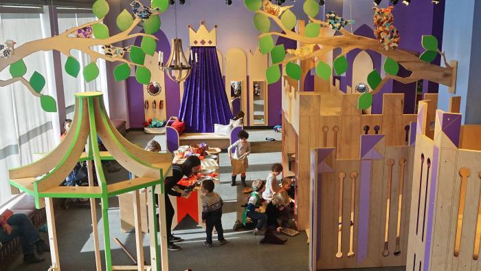 Children play at the mock kitchen and throughout the "Once Upon a Castle" exhibit. (Courtesy of Luci Creative)