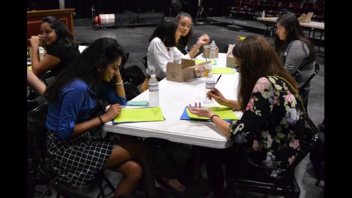 Students Megan Manne (left) and Gina Jagminas discuss what values are important to them. (Kristen Thometz / Chicago Tonight)