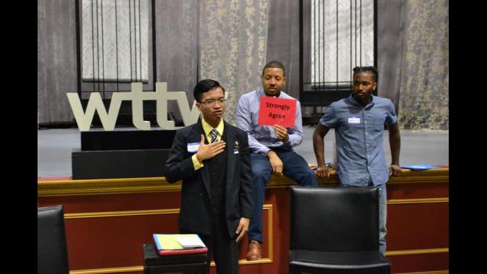 Jeromel Lara (left) explains his position while Ken Porter and Johnnie Brooks listen. (Kristen Thometz / Chicago Tonight)