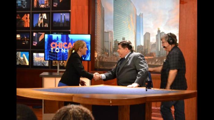 Amanda Vinicky and J.B. Pritzker shake hands before Monday’s forum. (Kristen Thometz / Chicago Tonight)