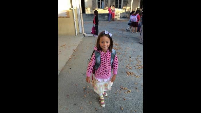 David's then-6-year-old daughter outside the village school. (Courtesy David McAninch)